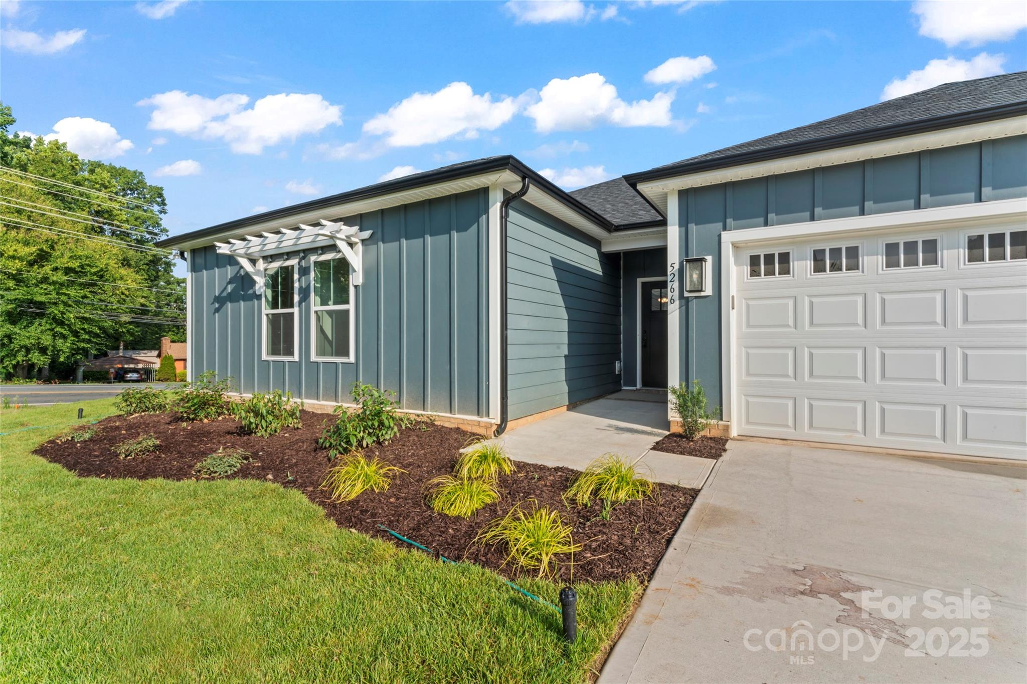1 Morehead Road Harrisburg, NC 28075 - Photo 2 of 32 a front view of a house with garden