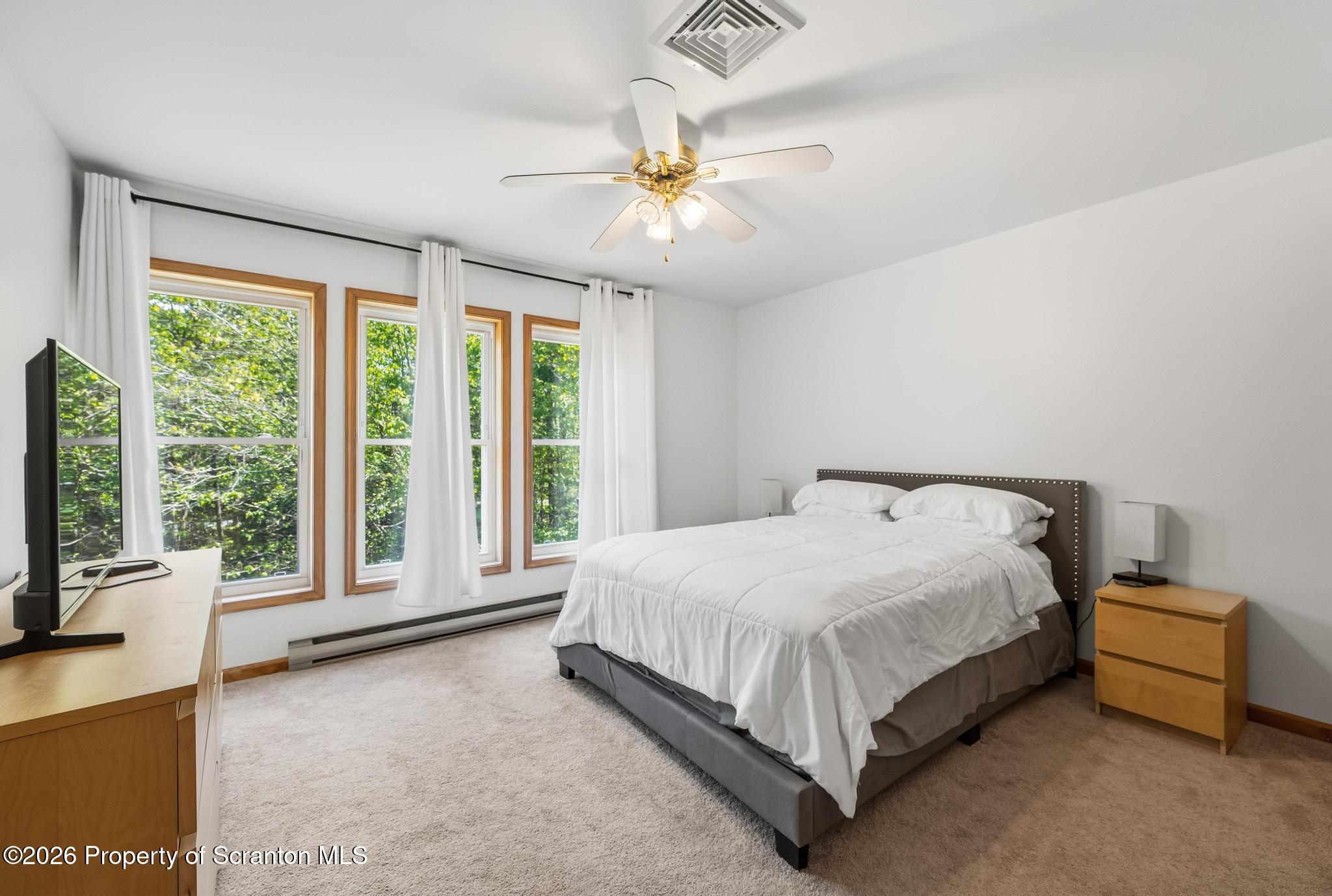 58 Bender Road Gouldsboro, PA 18424 - Photo 26 of 55 a bed sitting in a spacious bedroom next to a window