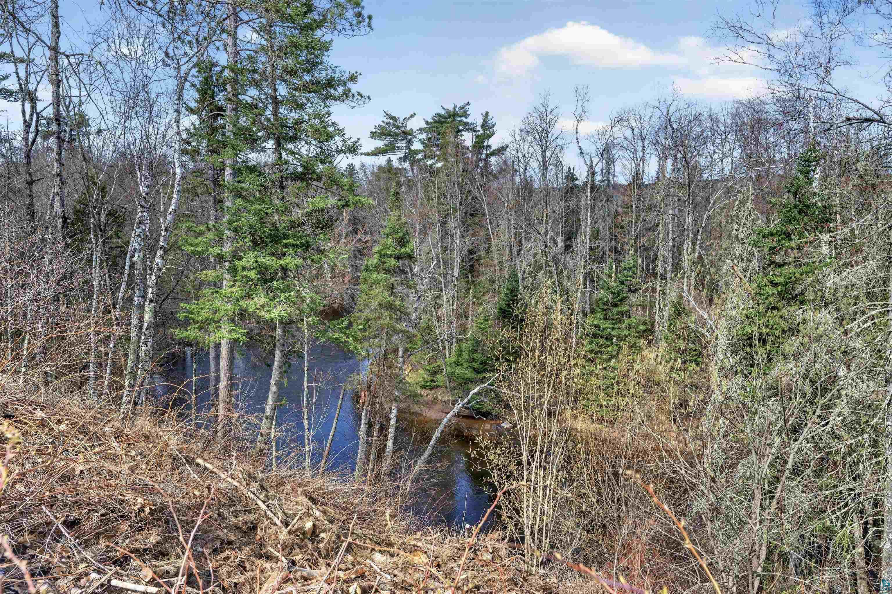 13885 Park Road Brule, WI 54820 - Photo 38 of 41 Natural surroundings featuring a waterway and abundant mature trees