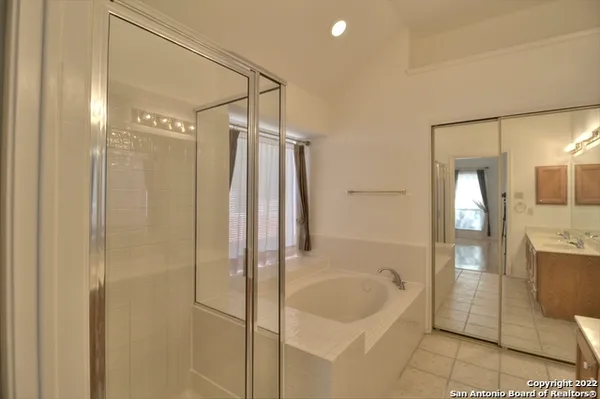 a bathroom with a bathtub and a shower
