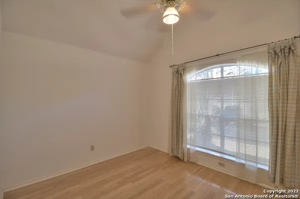 a bathroom with a bathtub shower sink vanity and toilet