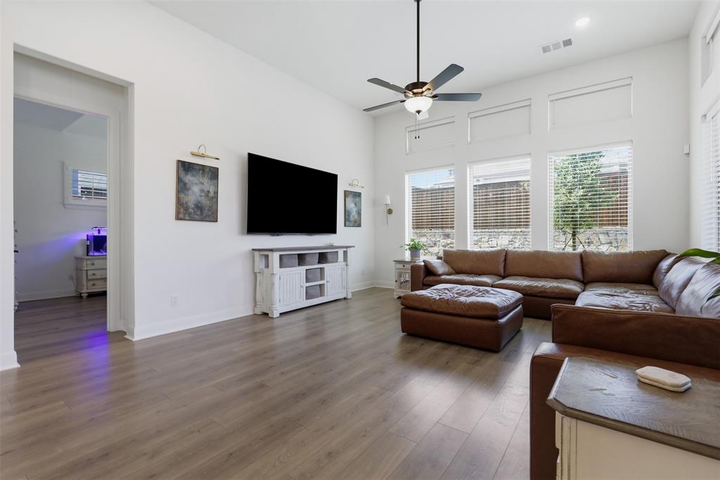 15413 Short Rdg Lane Fort Worth, TX 76008 - Photo 17 of 39 Bright living area with high ceilings, recessed lighting, wood-finish flooring, and multiple windows with blinds