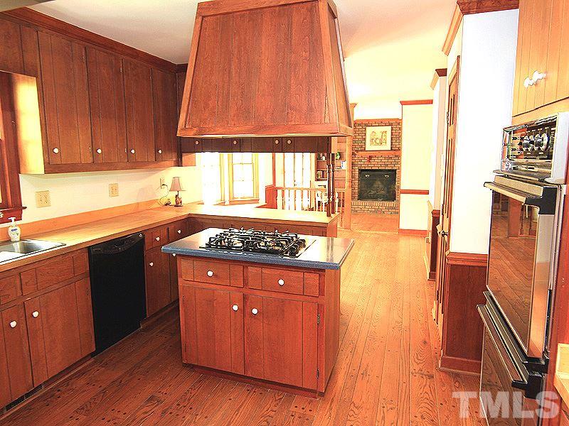 800 Mudham Road Wendell, NC 27591 - Photo 4 of 25 The kitchen has gas stove with hood and open to the breakfast area