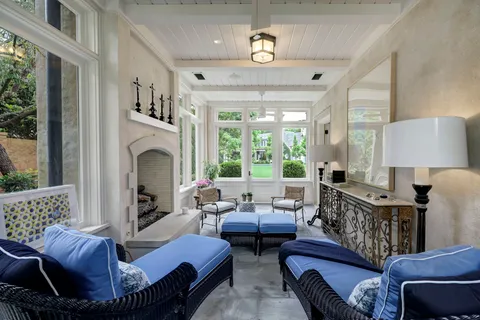 a view of a livingroom with furniture and a window