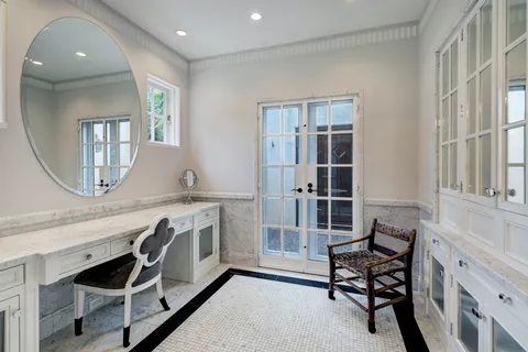 a bedroom with furniture and a window