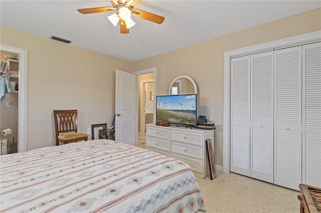4020 Palm Drive Punta Gorda, FL 33950 - Photo 18 of 24 a bedroom with a bed and a flat screen tv