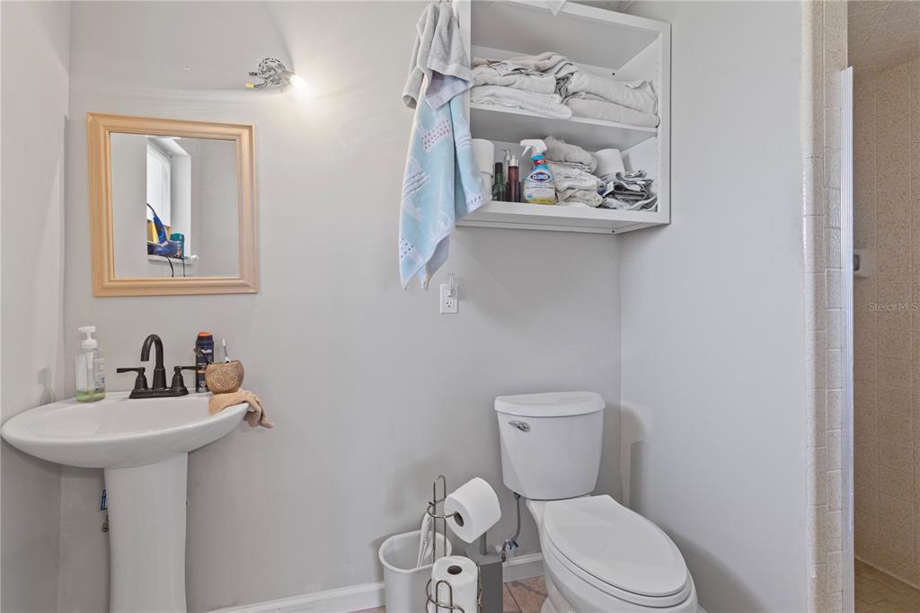 4020 Palm Drive Punta Gorda, FL 33950 - Photo 20 of 24 a white toilet sitting next to a bathroom sink