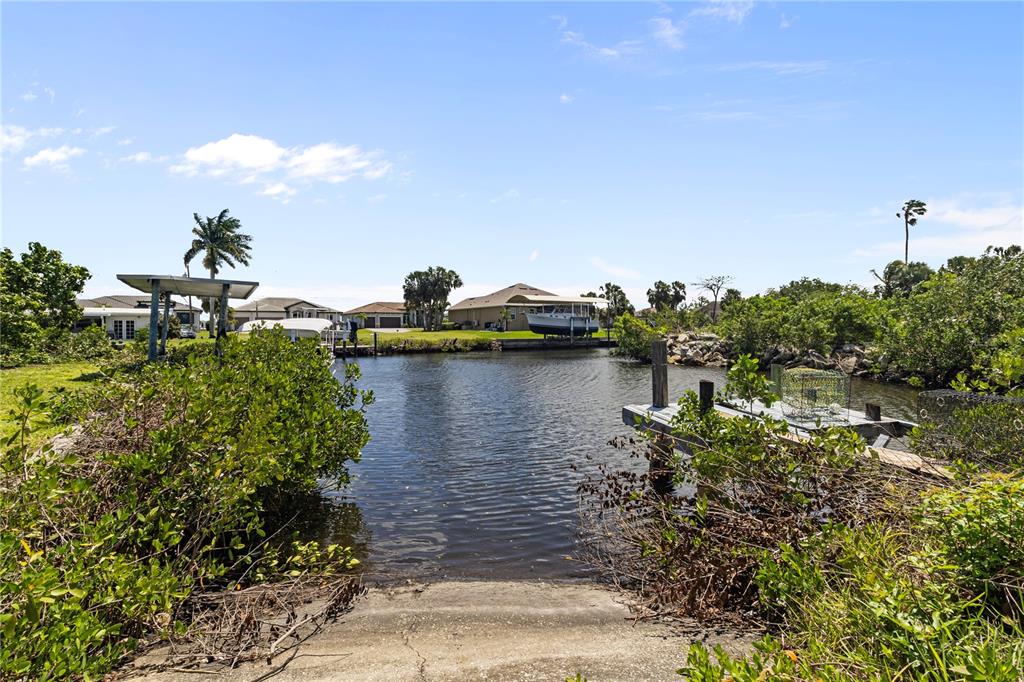 4020 Palm Drive Punta Gorda, FL 33950 - Photo 2 of 24 a view of a lake with a house