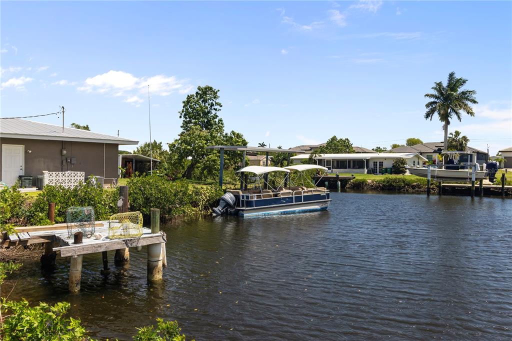 4020 Palm Drive Punta Gorda, FL 33950 - Photo 24 of 24 a view of a swimming pool with a lounge chair
