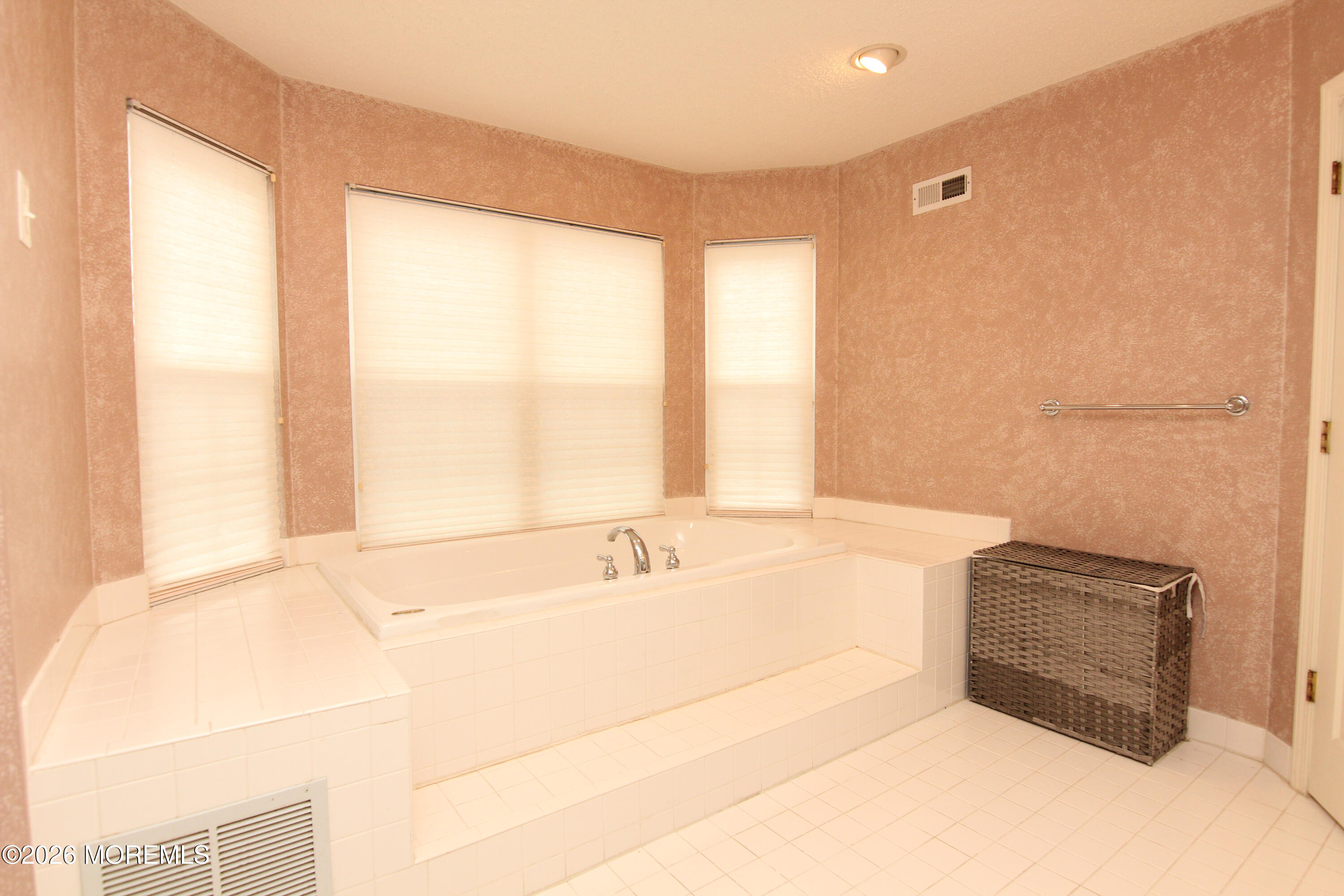 33 Austin Street Tinton Falls, NJ 07712 - Photo 9 of 46 a bathroom with a tub sink and window