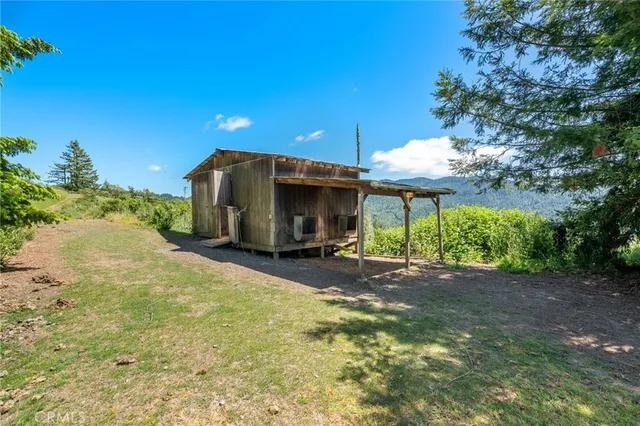 a view of a balcony with wooden floor and lake view