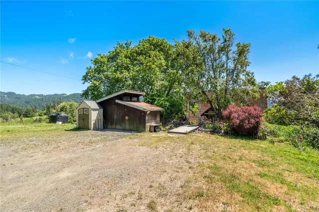 a bedroom with furniture and a large window