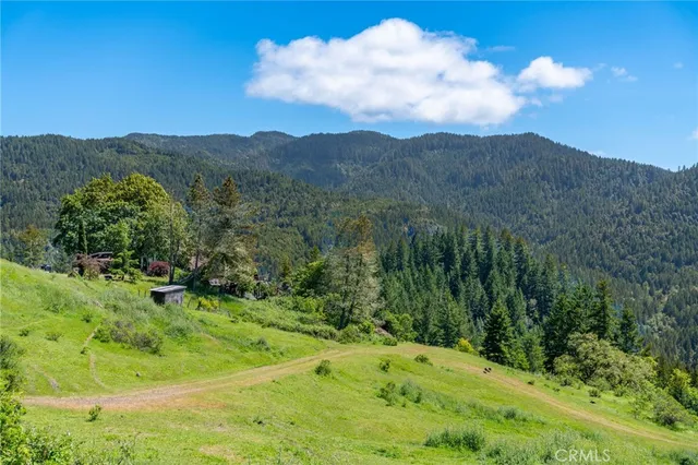 a backyard of a house with outdoor seating