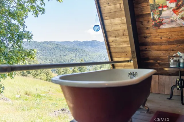 a bathroom with a granite countertop sink and a window