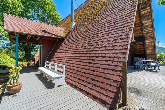 a bed room with a bed and a painting on the wall