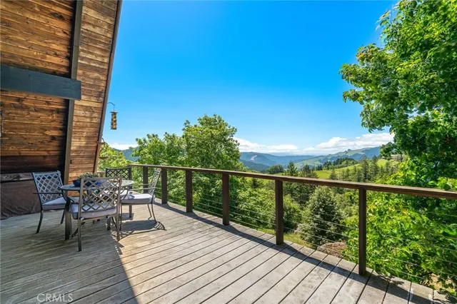 a kitchen with stainless steel appliances granite countertop a stove and a wooden floors