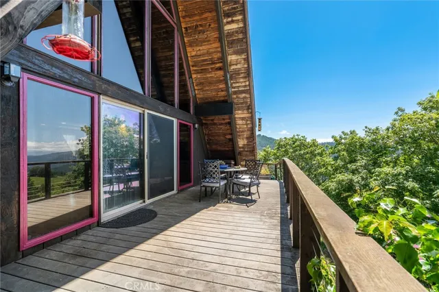 a view of a chairs and table in the patio
