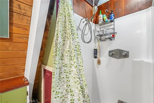 a dining room with furniture window and wooden floor