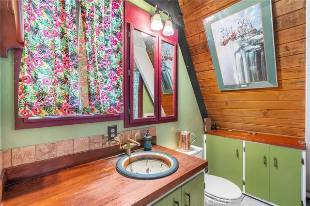 a view of a livingroom with furniture and staircase