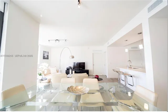 a living room with furniture and white walls