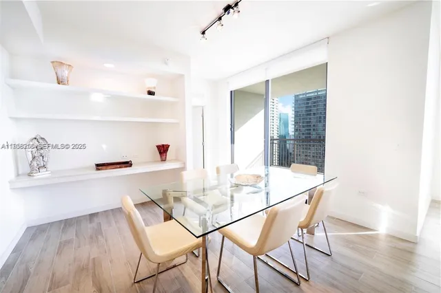 a dining room with a table and chairs