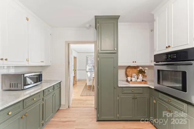 a kitchen with stainless steel appliances granite countertop a stove a sink dishwasher and a refrigerator