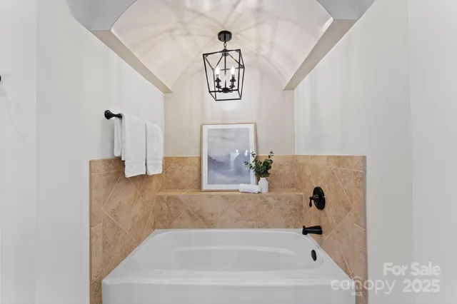 a bathroom with a bathtub and shower