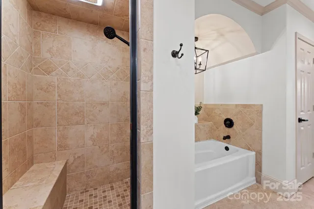 a spacious bathroom with a granite countertop sink mirror and a shower