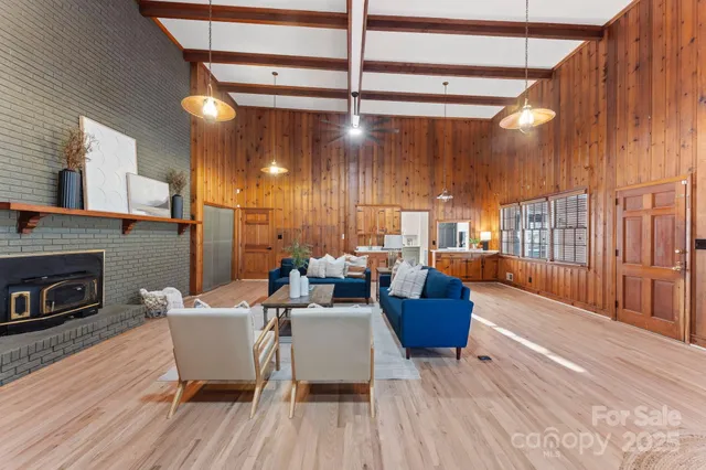 a view of patio with a table and chairs and potted plants