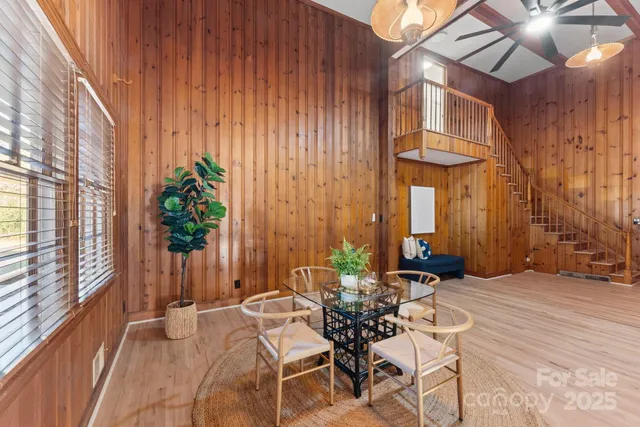 a spacious bathroom with a double vanity sink a mirror and a bathtub