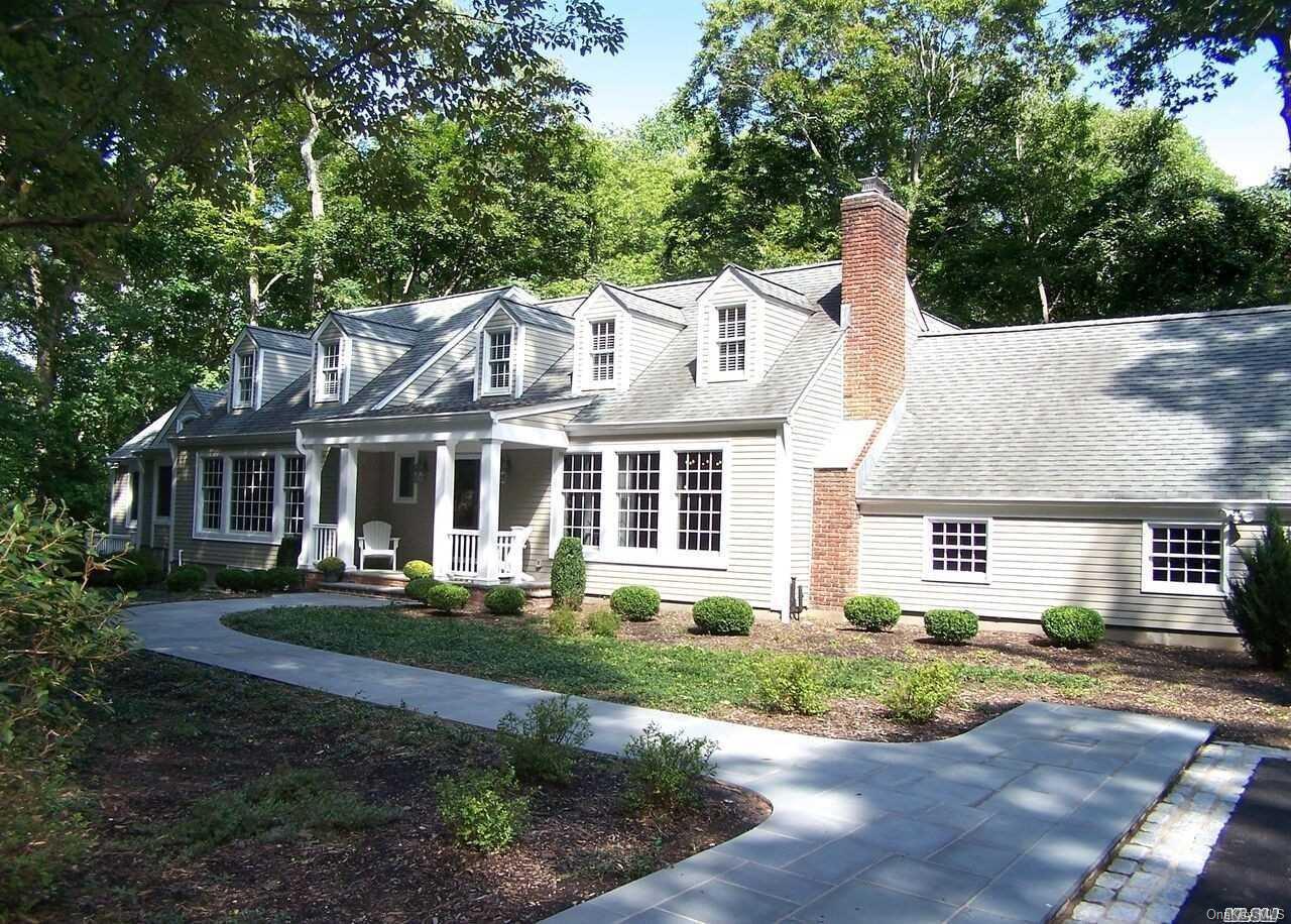 40 Bacon Road Head of the Harbor, NY 11780 - Photo 1 of 1 a front view of a house with a garden