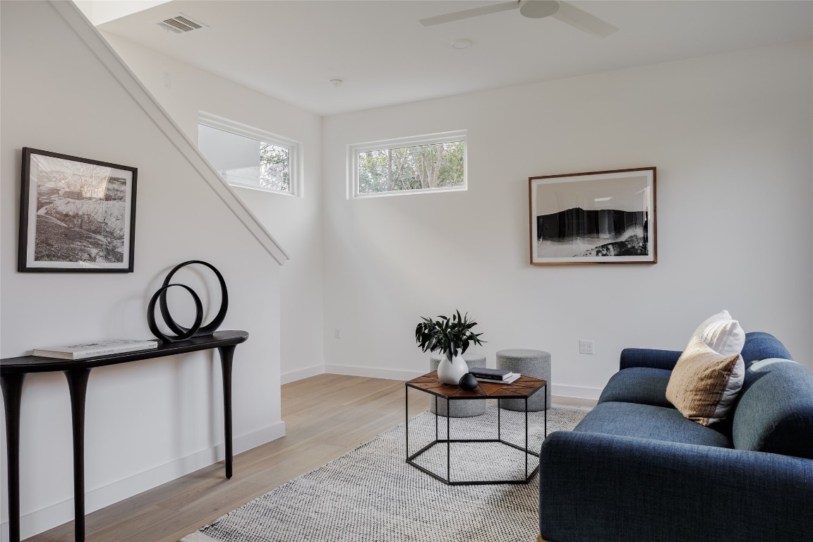 3209 Dolphin Drive, Unit 2 Austin, TX 78704 - Photo 14 of 40 a living room with furniture and paintings on the wall