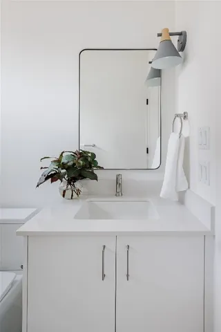 a bathroom with a shower a toilet and sink