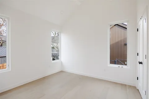 a bathroom with a granite countertop sink a toilet and a mirror