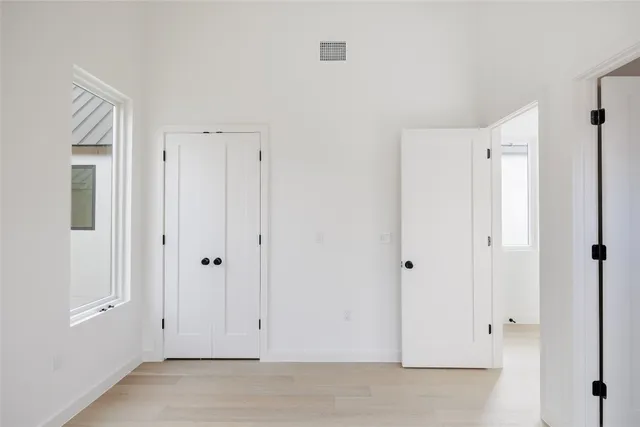 a bathroom with a granite countertop sink a toilet and a mirror
