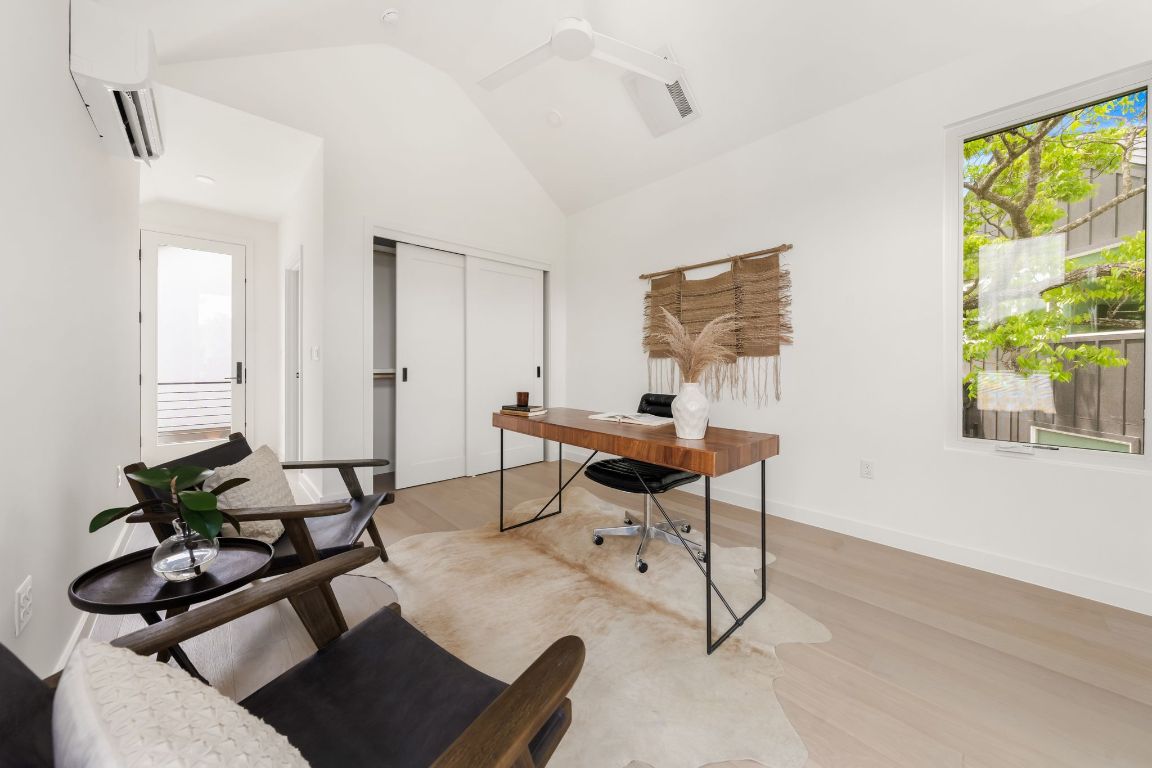 3209 Dolphin Drive, Unit 2 Austin, TX 78704 - Photo 33 of 40 a view of a workspace with furniture and a window
