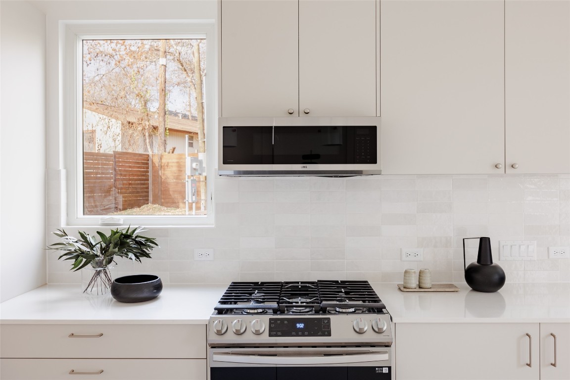 3209 Dolphin Drive, Unit 2 Austin, TX 78704 - Photo 8 of 40 a kitchen with a stove and a window