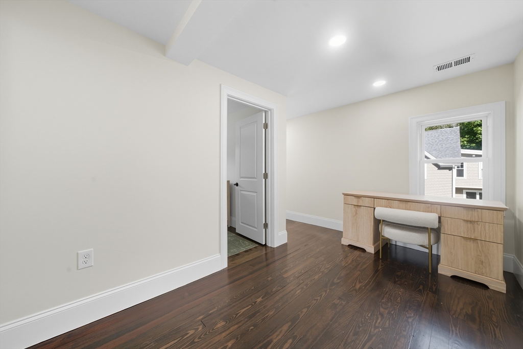 400 Adams Street, Unit A Milton, MA 02186 - Photo 13 of 27 a view of a room with wooden floor a sink and a window