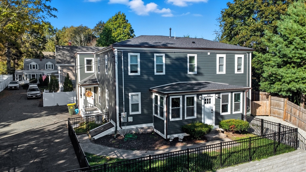 400 Adams Street, Unit A Milton, MA 02186 - Photo 22 of 27 a front view of a house with porch