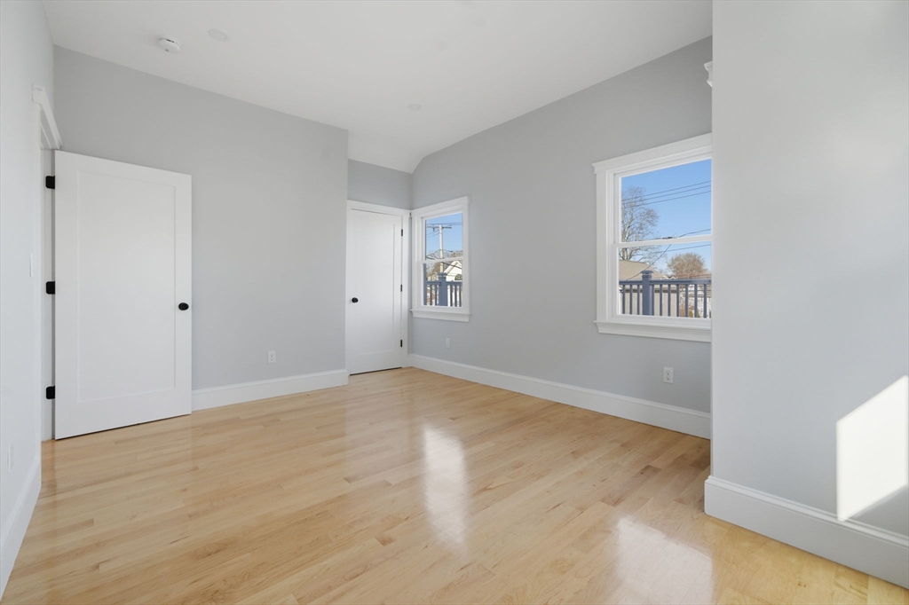 400 Adams Street, Unit A Milton, MA 02186 - Photo 27 of 27 a view of an empty room with a window