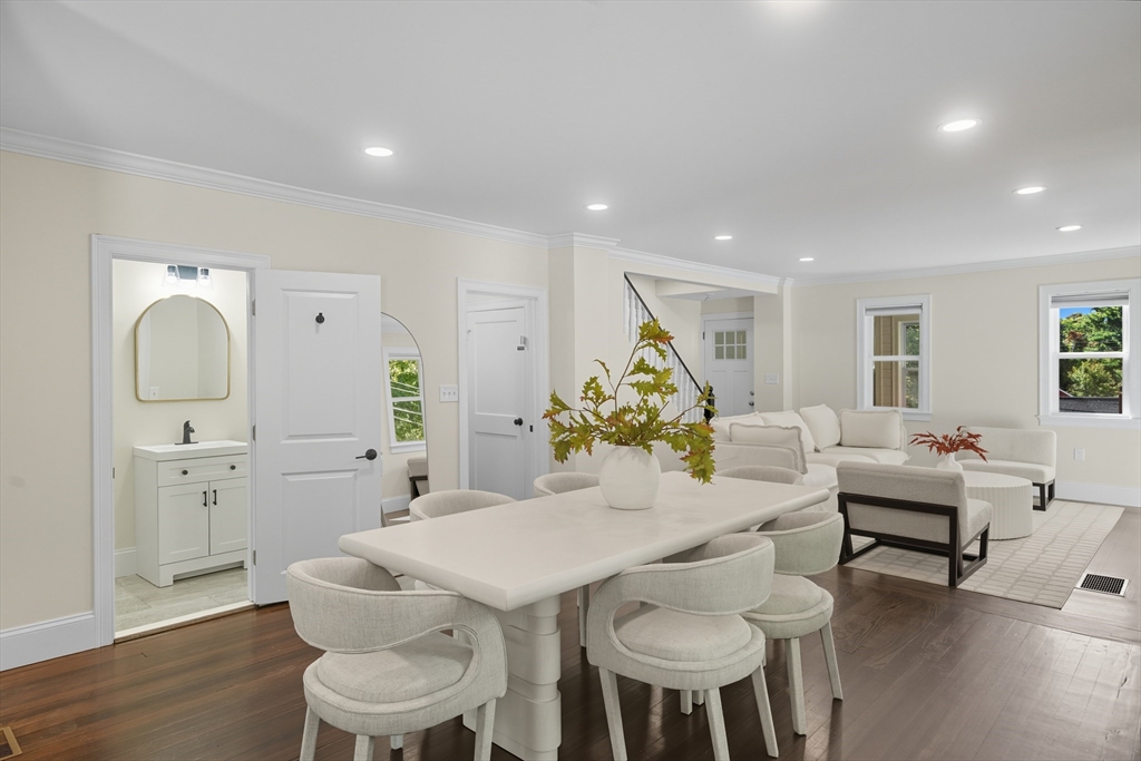 400 Adams Street, Unit A Milton, MA 02186 - Photo 4 of 27 a view of a dining room with furniture and wooden floor
