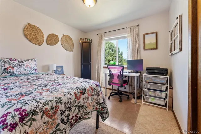 a living room with furniture fireplace and wooden floor