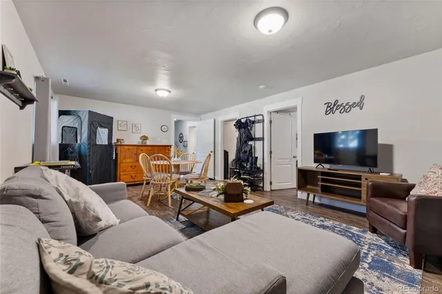 a spacious bathroom with a toilet a sink and a mirror
