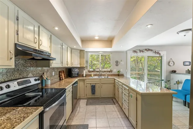 a bathroom with a sink a toilet and shower curtain