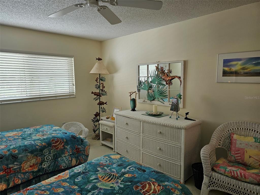4765 Independence Drive Bradenton, FL 34210 - Photo 20 of 39 a bedroom with a bed and a window