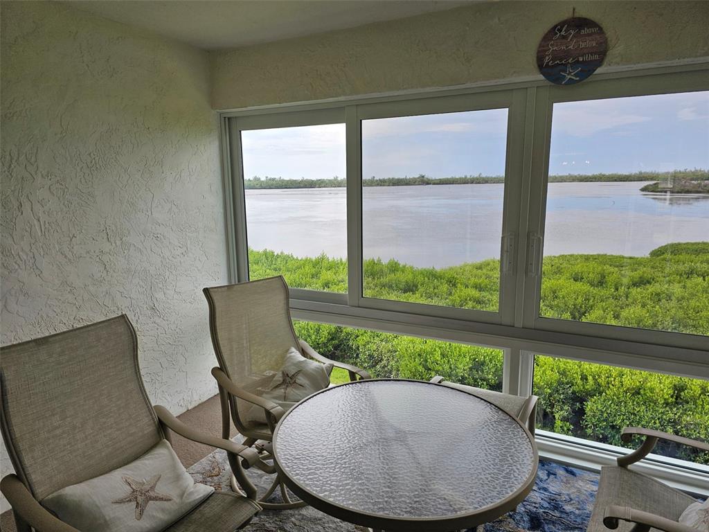 4765 Independence Drive Bradenton, FL 34210 - Photo 25 of 39 a view of a chairs and table in patio