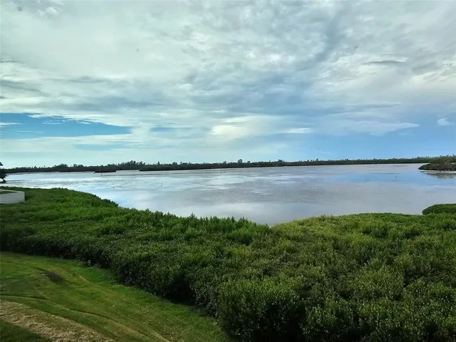 a view of a lake with a big yard