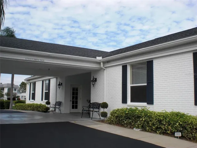 a couple of potted plants in front of door
