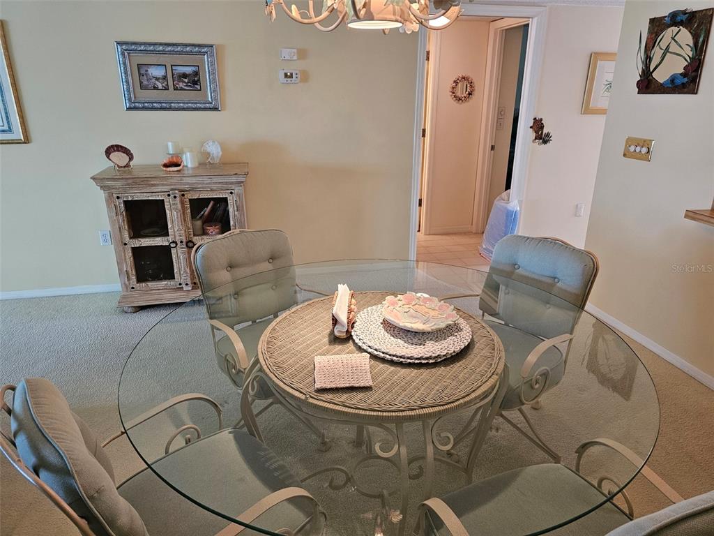 4765 Independence Drive Bradenton, FL 34210 - Photo 10 of 39 a living room with furniture and a table