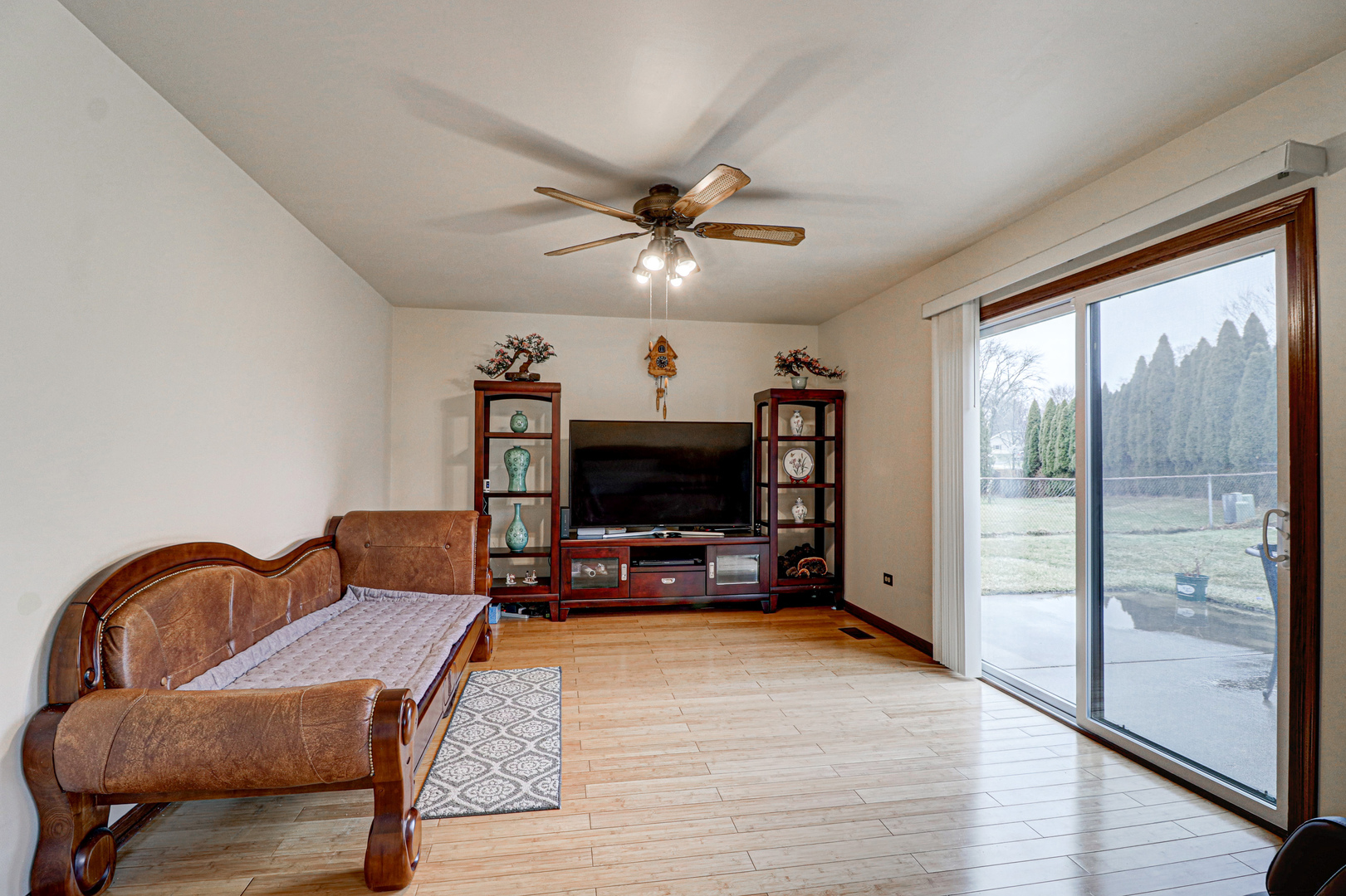 1126 Manchester Road Schaumburg, IL 60193 - Photo 12 of 28 a living room with furniture a flat screen tv and a floor to ceiling window